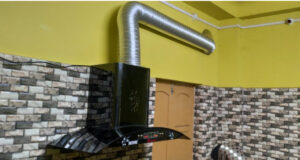 kitchen chimney with duct for flue gas
