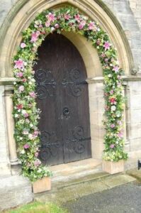 floral decorations at door of homes