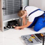 Technician Checking Refrigerator